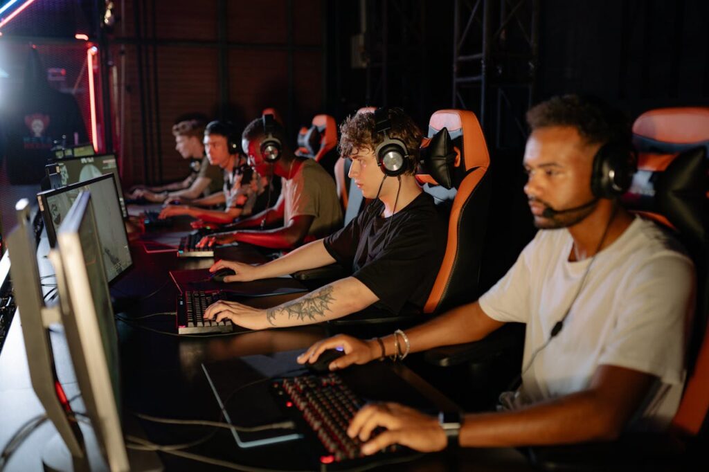 pexels photo 9072212 A group of focused young gamers playing in an intense esports tournament indoors.