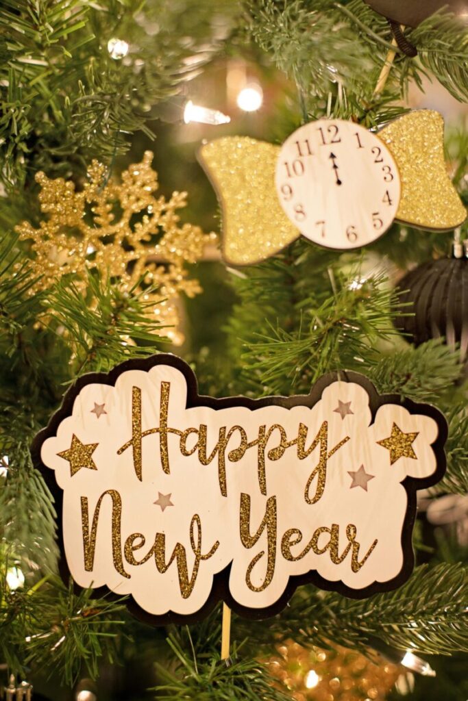 Photo by Jill Wellington Close-up of a beautiful New Year sign with festive Christmas decorations.